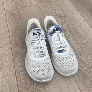 APL running shoes in a size 6. White with blue tie dye on the front and back.